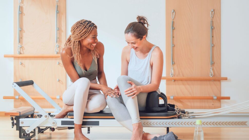 Smiling Pilates student after a Reformer class, celebrating Cork launch offer