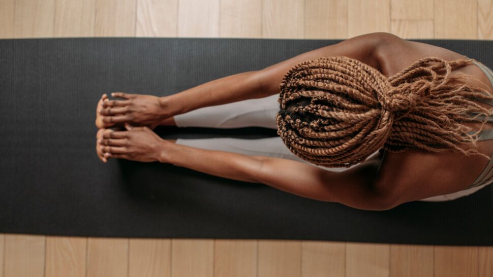 A woman doing Mat Pilates in the studio in Cork